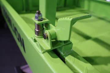 The green lever of the industrial machine.