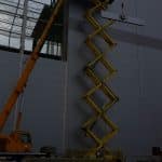 Scissor lift at a construction site.