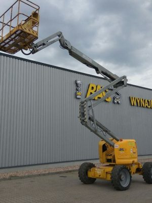 Telescopic lift in front of an industrial building.