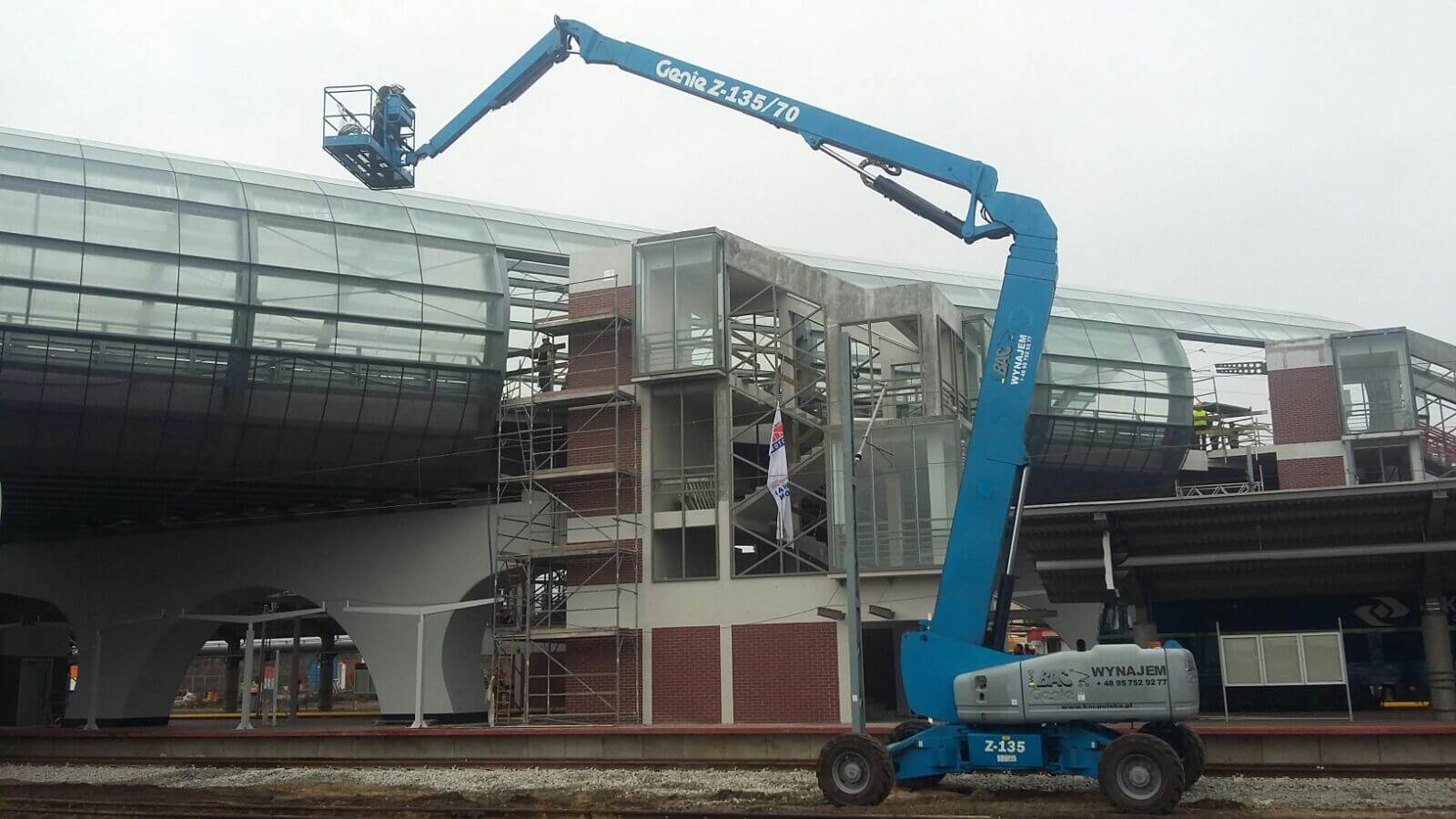 Telescopic lift at railroad station construction work.