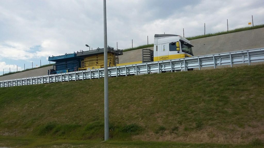 A truck entering a vehicle weighing station.