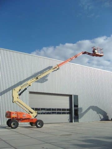 An aerial lift at an industrial building.
