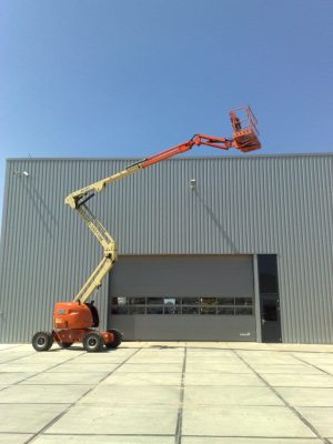 An aerial lift at an industrial hall.