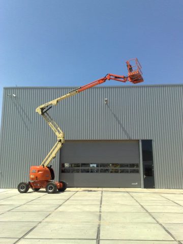 An aerial lift at an industrial hall.