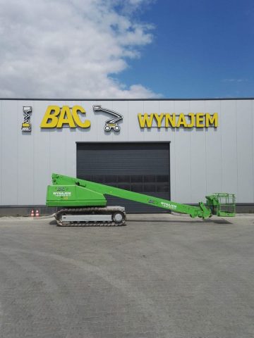 Green lift platform in front of the building "BAC RENT".