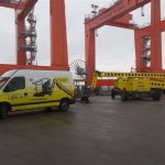 Yellow service vehicle and transport module at the terminal.