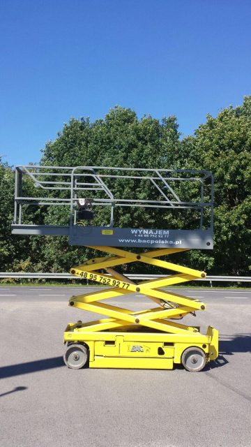 Yellow outdoor scissor lift.