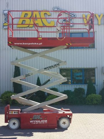 Red elevator work platform in front of the building.