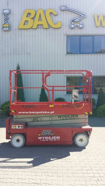 BAC scissor lift in front of the company's building.