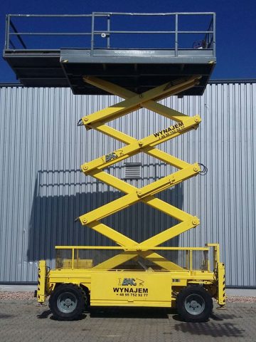 Yellow lift platform outside next to the hall.