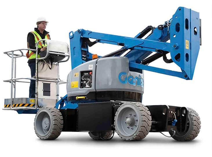 A worker on a Genie brand scissor lift.