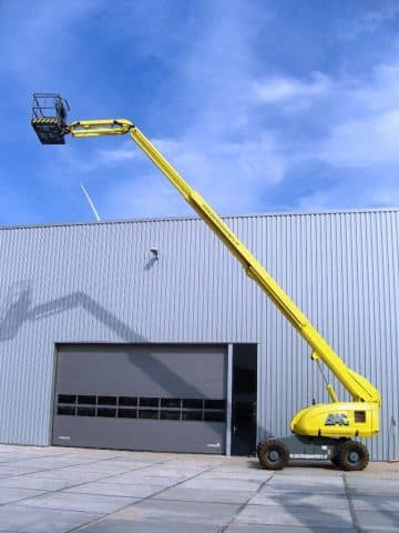 An aerial lift at an industrial building.