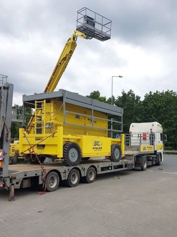 An aerial lift on a truck trailer.