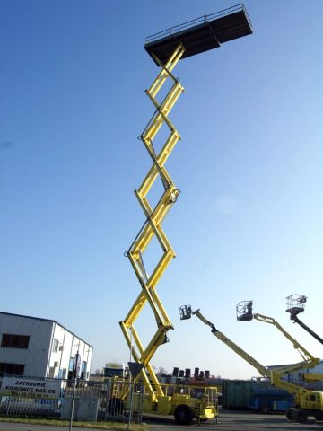 Yellow scissor lift extended upward.