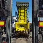 Lift on a trailer between loading ramps.