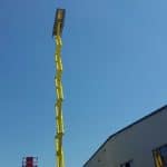 Scissor lift in front of the industrial hall.