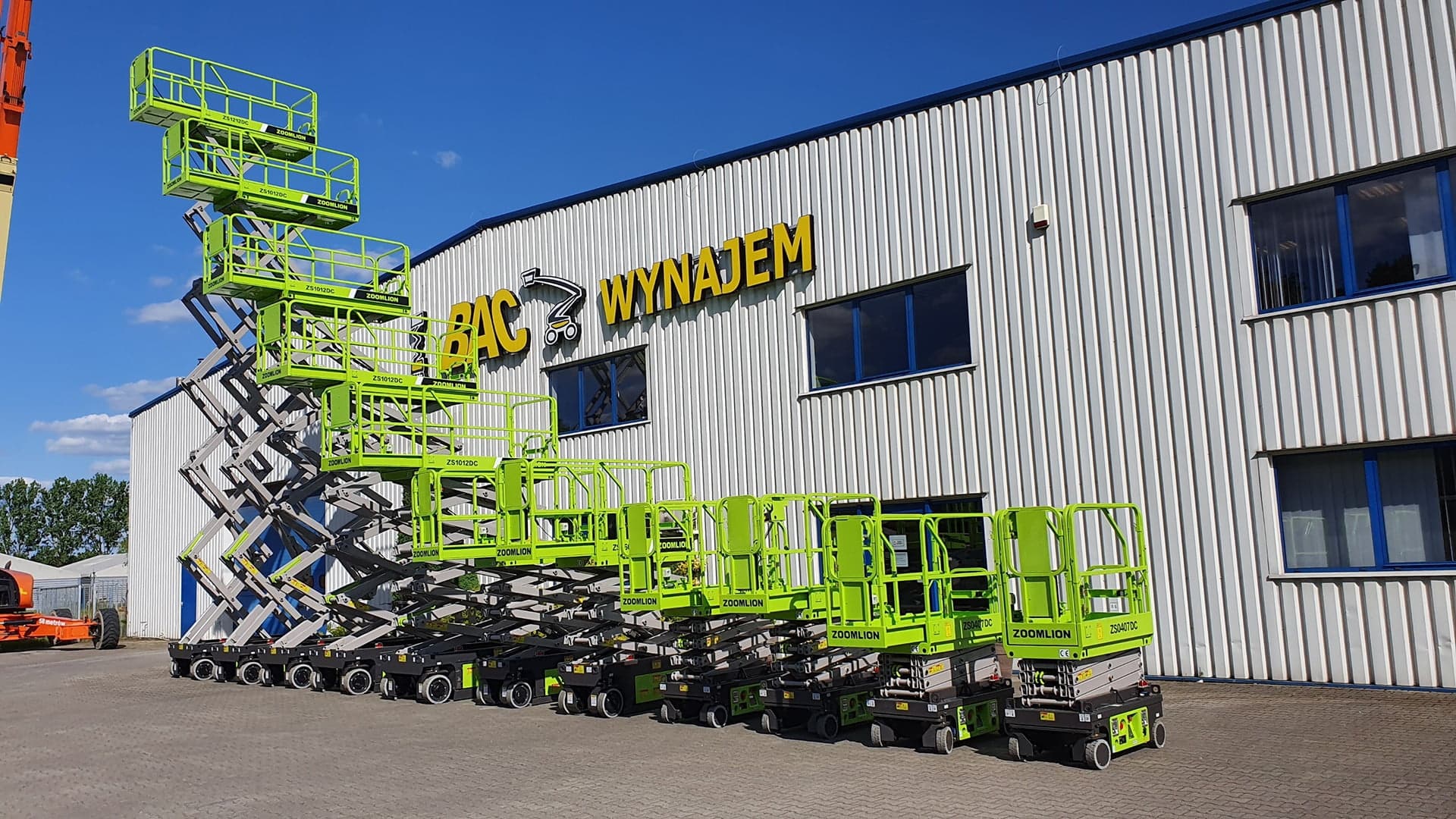 Zoomlion aerial lifts in front of the company's building.