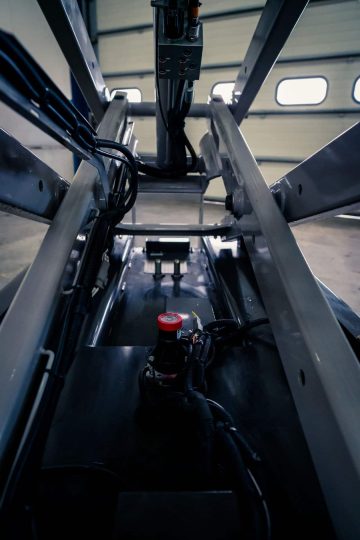 The interior of an industrial elevator seen from below.