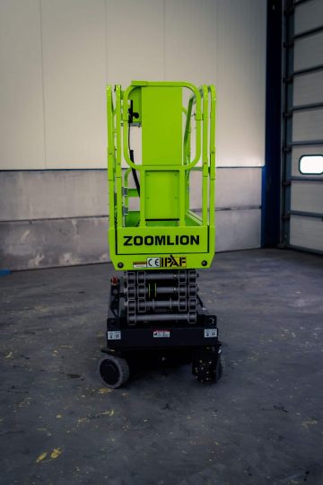 Green Zoomlion scissor lift in the warehouse.