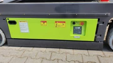 The control panel of the yellow construction elevator.