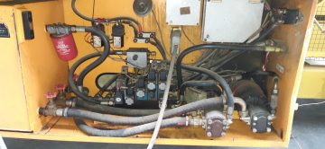 Hydraulic power unit with hoses and valves.