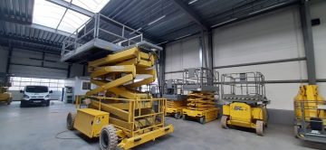 Scissor lifts on the industrial floor.