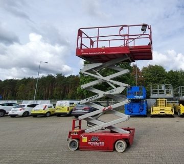 Scissor lift in the equipment rental parking lot.