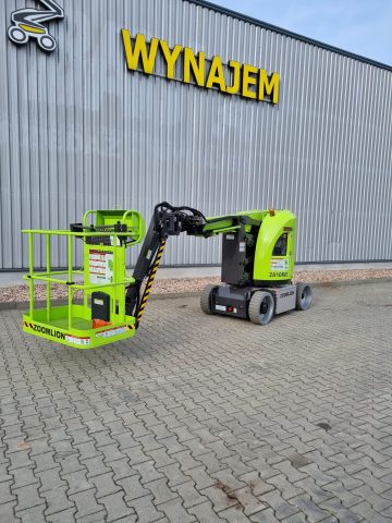 Green Zoomlion aerial lift in front of the building "RENT".