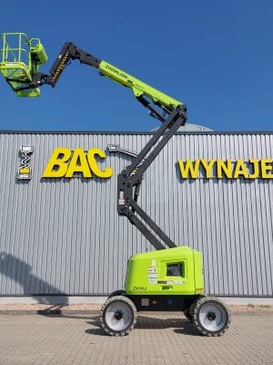 Zoomlion aerial lift in front of a building with a sign reading "Rental."