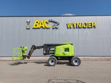 Green aerial lift in front of the building "BAC Rental".