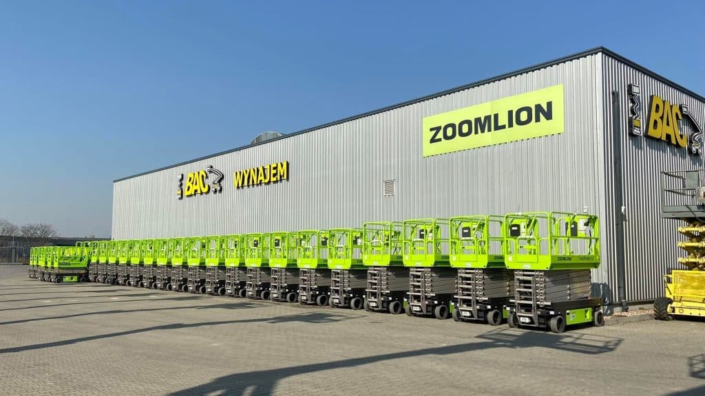 BAC warehouse and a row of green Zoomlion scissor lifts.