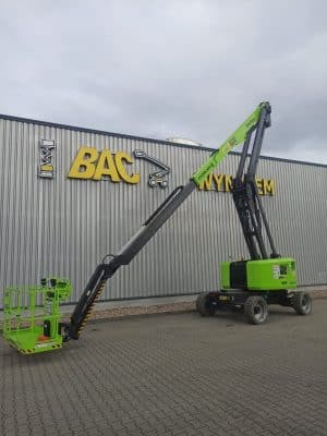 An aerial lift in front of the BAC WYNJEM warehouse.