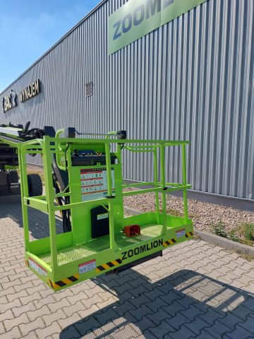 Zoomlion's green lift platform in front of the building.