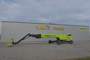 Zoomlion aerial lift in front of the hall with a rental sign.