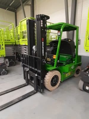 Green forklift in the warehouse.