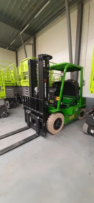 Green forklift in the warehouse.