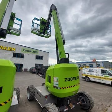 Zoomlion aerial lift in front of equipment rental company.