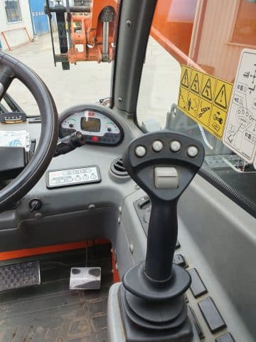 Cockpit and levers in a forklift.