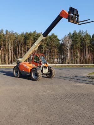 Telescopic forklift at a construction site.