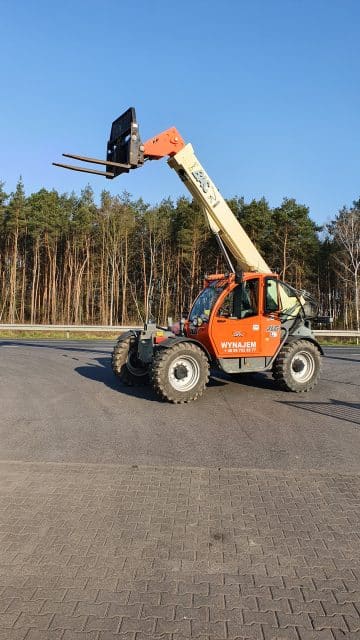 Telescopic forklift at a construction site.