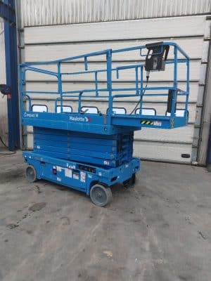 Blue Haulotte Compact 14 scissor lift in stock.