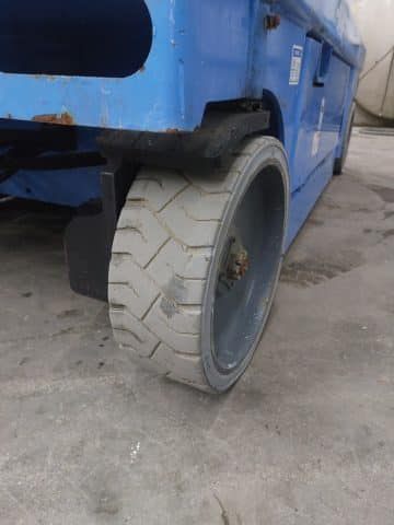 The tire of an industrial vehicle on the shop floor.