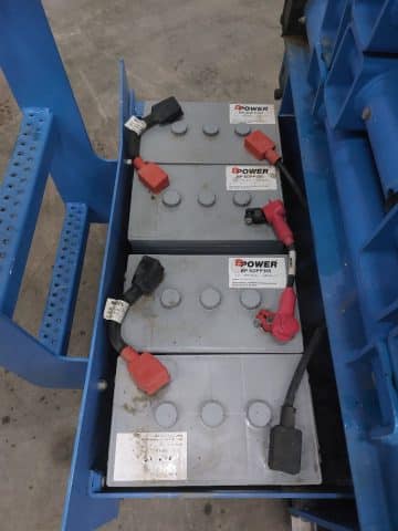 Industrial batteries on a transport pallet.