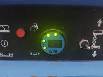 Machine control panel with display and buttons.