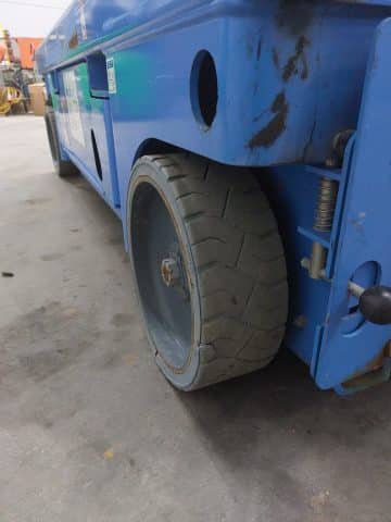 Blue forklift, close-up of the wheel.