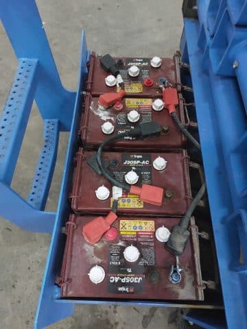 Industrial batteries on a pallet in stock.