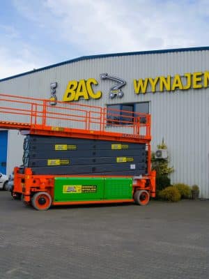 Scissor lift in front of the equipment rental warehouse.