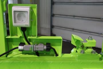 Green industrial device with LED lighting.