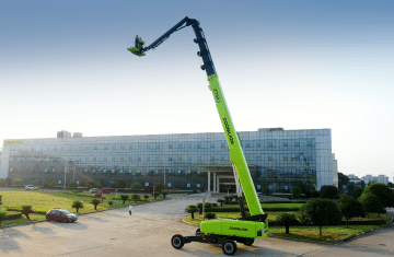 Zoomlion aerial lift in front of modern building.